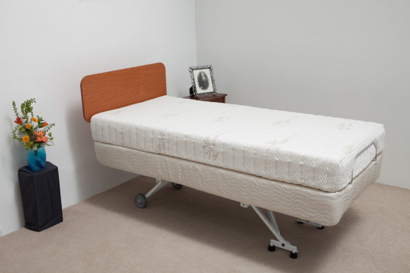 Hi-lo electric bed fully elevated for caregiver access